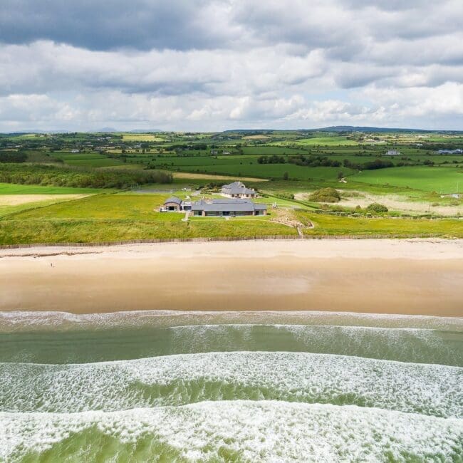Aerial view of Rochtaine Camelot oceanfront luxury estate set along Ireland’s Atlantic coastline