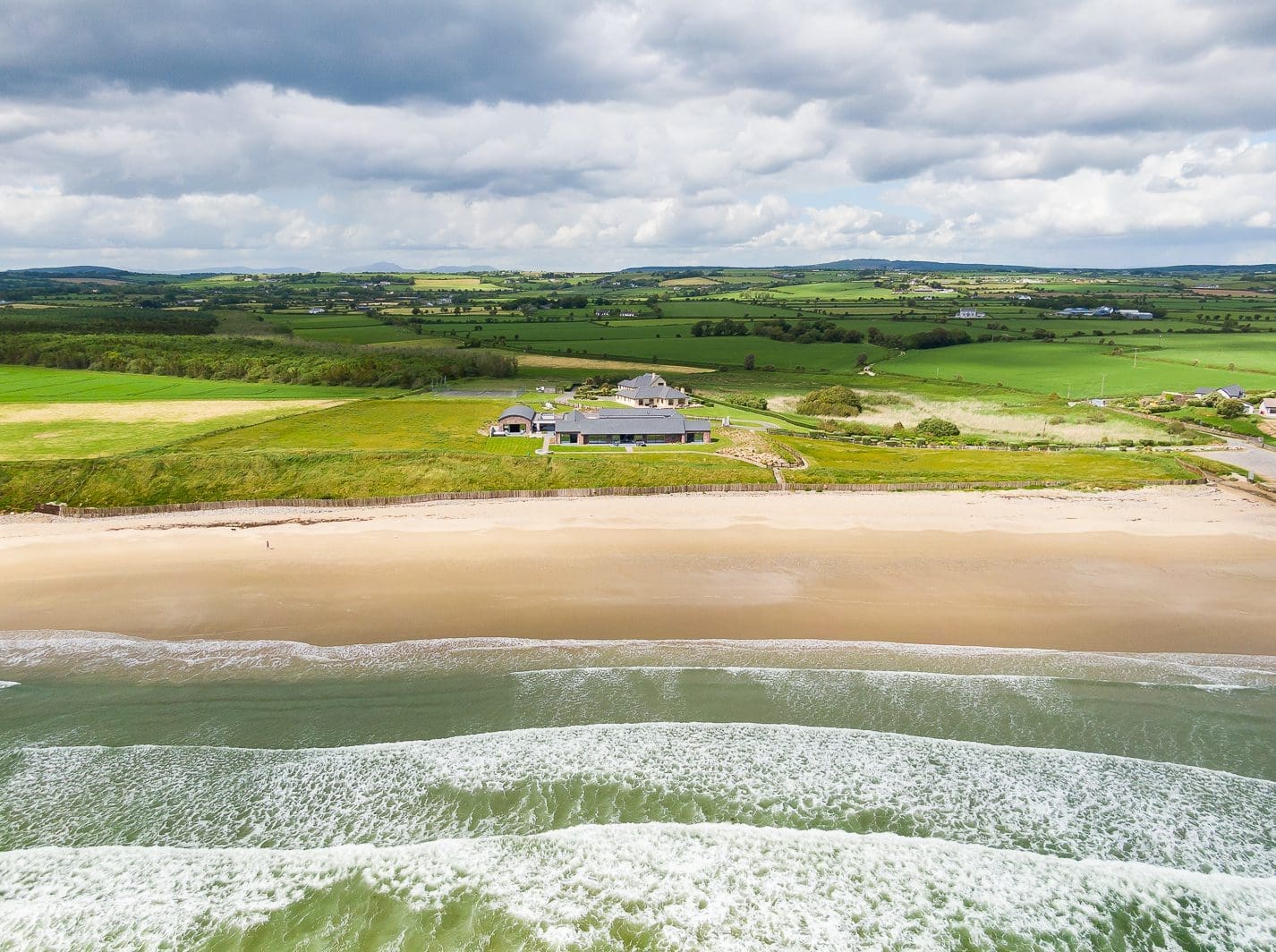 Aerial view of Rochtaine Camelot oceanfront luxury estate set along Ireland’s Atlantic coastline