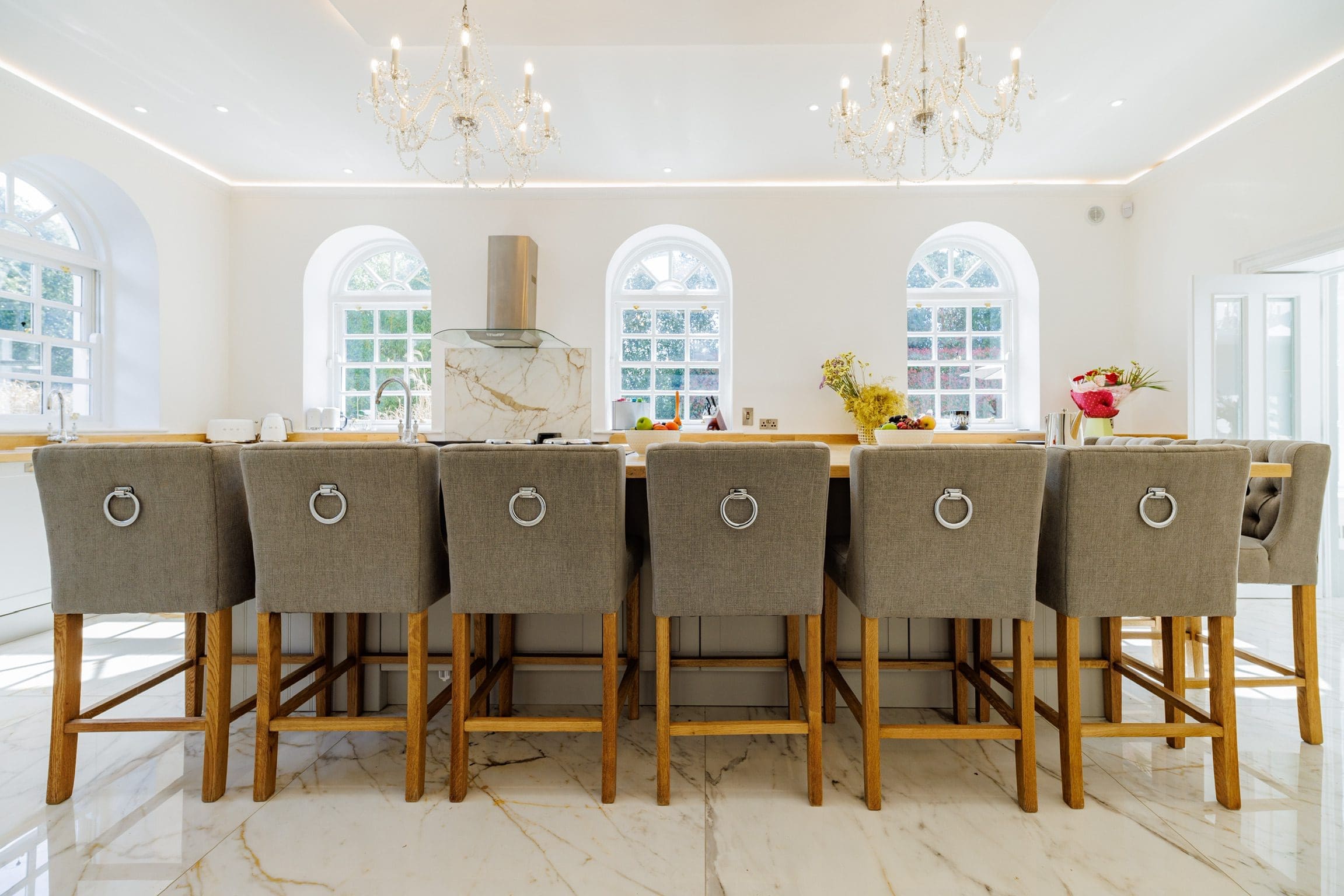 modern_fully_fitted_kitchen_central_bar_10_seats_2_chandeliers_rochtaine_mansion_mount_juliet_kilkenny